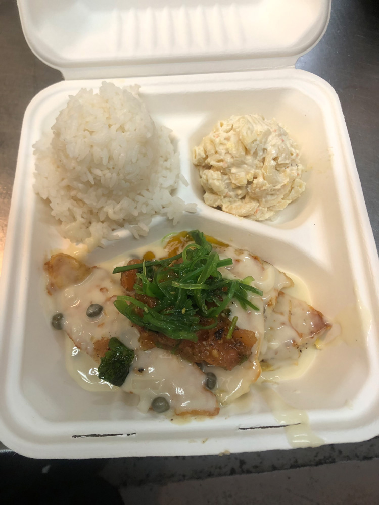 Sautéed Mahi-mahi with a lemon butter Caper sauce topped with Roasted tomatoes and sea salad.