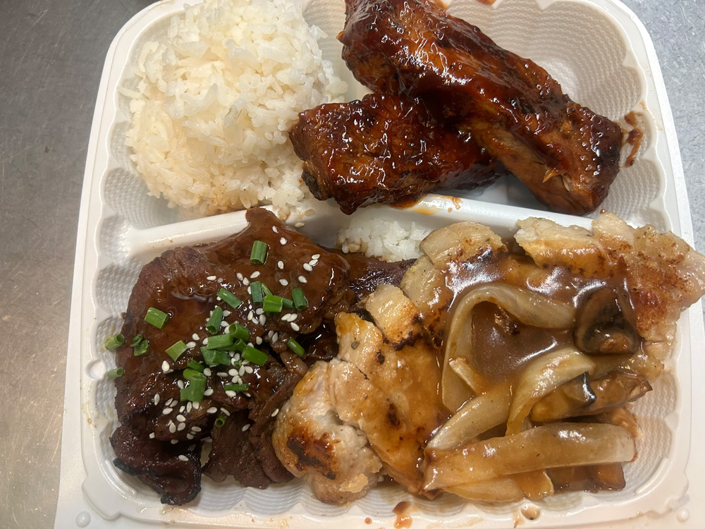 lb-Leeward Bowl Trio, BBQ pork ribs, teriyaki beef and sautéed pork chops with mushroom and onion gravy.